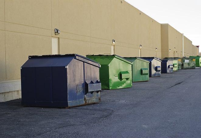 a large dumpster awaits materials from a renovation project in Hallandale Beach