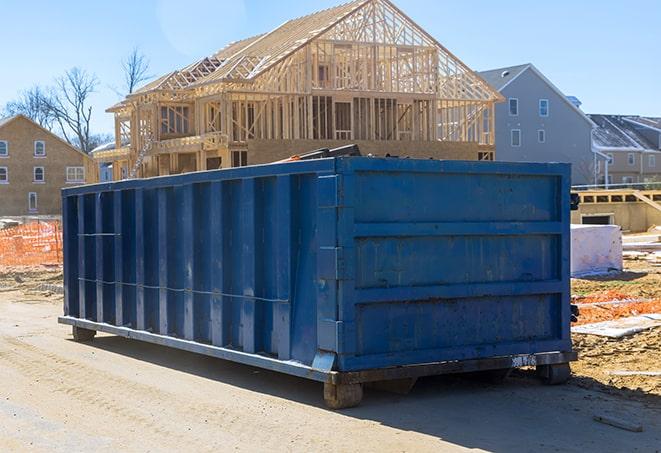 a pile of household trash waiting to go into the reliable residential dumpsters